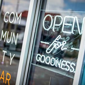 Exterior of "Community Market" a sign "Open for goodness".