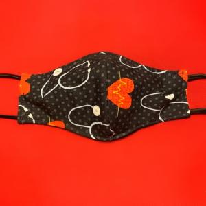 a protective fabric mask against a red background