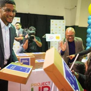 Stockton Mayor Kevin Lincoln handing out laptops at Astronaut José M. Hernandez Academy, an El Concilio location in Stockton. 