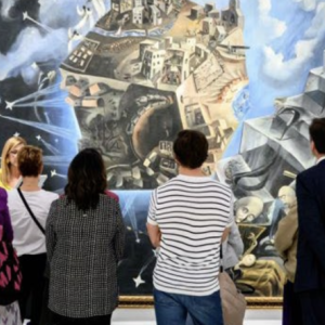 Group viewing large painting