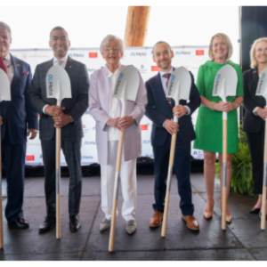Six people posed with shovels