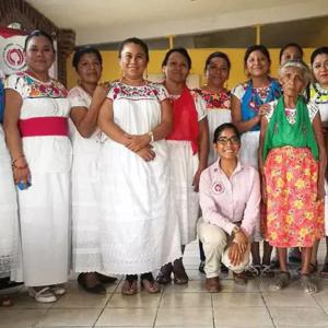 a group of people in traditional Mexican clothing