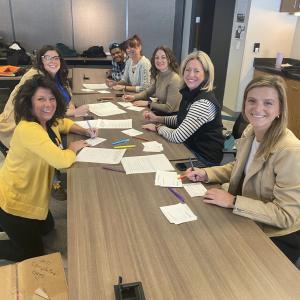 volunteers at a long table
