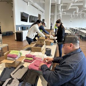volunteer packing zippered bags with washcloths