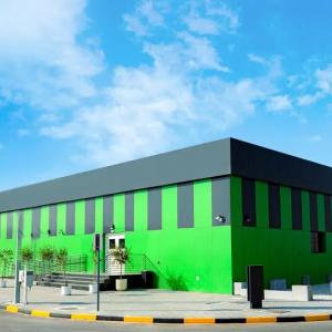 A building exterior painted black and green. "MORO" on the side.