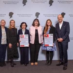 Six people stood together for a group photo