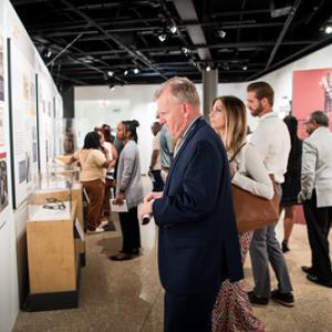 People viewing museum exhibits.