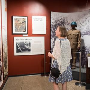 A person viewing museum exhibits.