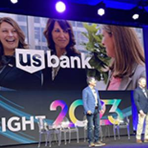 Transformation strategy executive Tina Cartwright and shared services leader Jay Clark accept the Financial Services Impact Award.