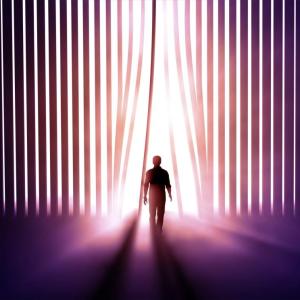 person walking into light