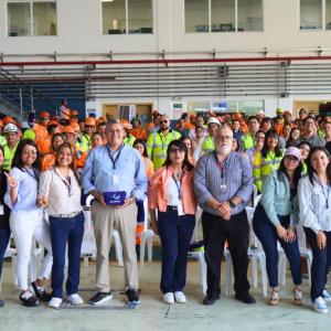 A large group of people posing and smiling