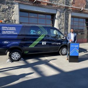 National Grid spokesperson in front of new Ford vehicle