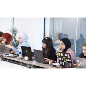 Group of young women on laptops