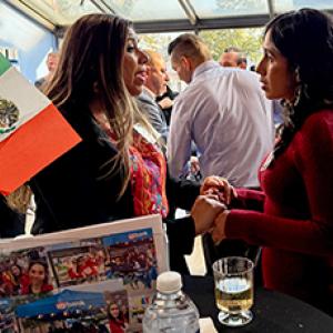 Two people talking at a networking reception