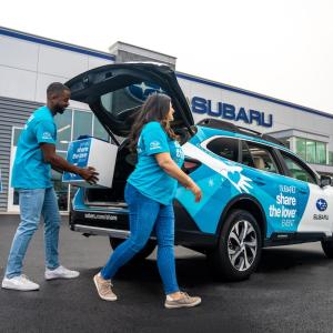 people packing up a car