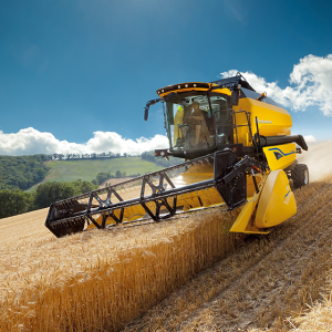 Yellow machine in action in a field