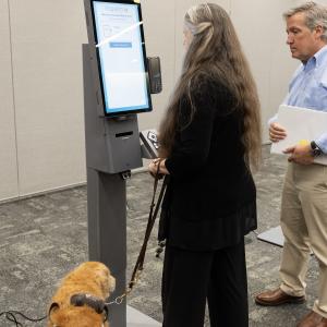 people using self-service kiosk