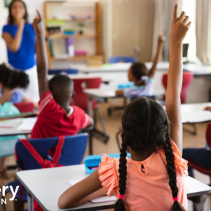 Children raising their hands in a classroom