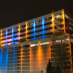 T-Mobile Headquarters in Bellevue, WA lit up in yellow and blue lights