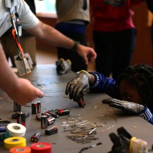 teachers working with students in a classroom
