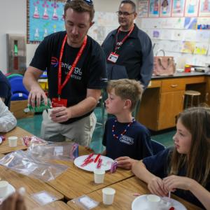 teachers working with students in a classroom