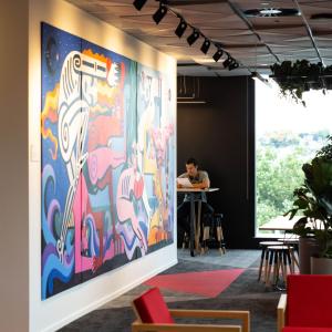 office space with a large painting