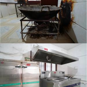 Side by side pictures of the old coal fired stove and new electric double stove and refrigerator.