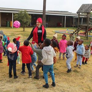 a group of children playing outside in a courtyard