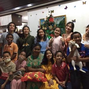 Youth and caretakers gather at the House of Love.