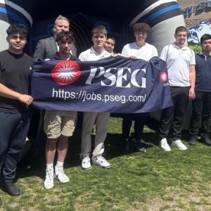 people holding a PSEG banner