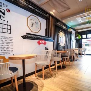 a restaurant with cultural art work and writing on the walls