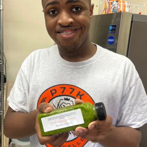 person holding up a juice