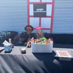 Two people working at the VIP Concierge table