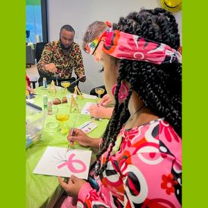 Employees doing a paint and sip