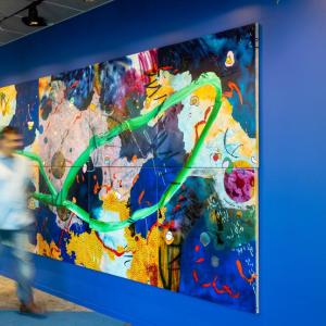 large painting against blue wall