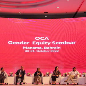 panel of speakers on a stage