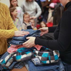 People handling clothing