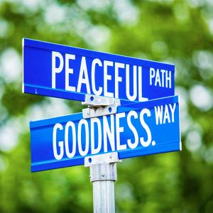 Sign post with "Peaceful path and Goodness way"