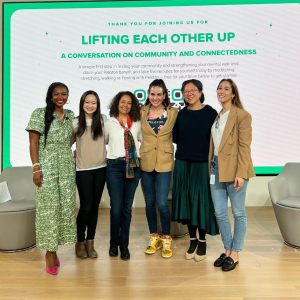 six people standing on a stage