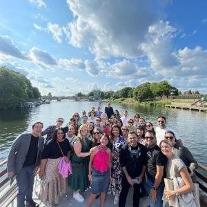 A team of people posed outside