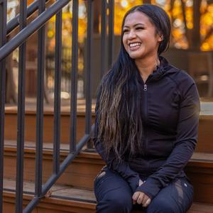 person smiling on steps
