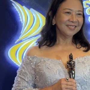 Someone holding an award