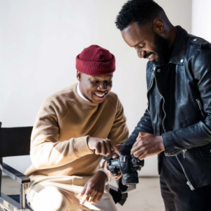 Two people looking at a camera