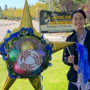 a person holding a pinata outside