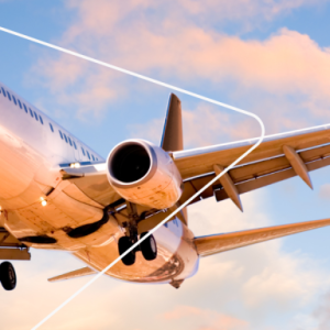 a plane in the air, clouds in a blue sky behind it