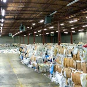 A warehouse full of bales of plastics