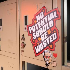 Lockers in a row. One with a sign "No potential should be wasted."