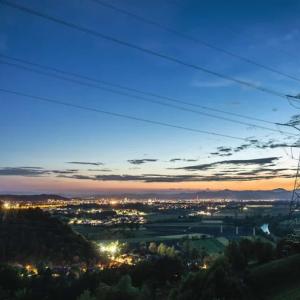 Power lines and a sunset behind.