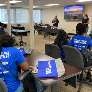 two staff present to a room of students seated at desks
