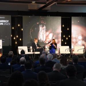 Allyson Anderson Book and another on stage talking in front of an audience.